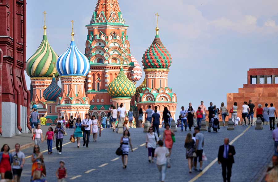 Crowds walking near Moscow, St. Basil's Cathedral in Red square, Russia.