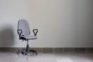 Empty office chair in an empty room